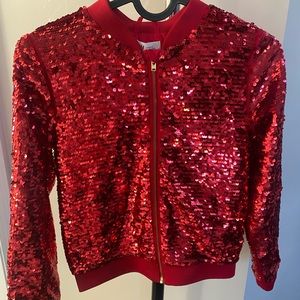 Red Sequins girl’s jacket.Brand is H&M. Size is 8-9 girls